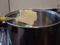 Adding butter to potatoes Adding butter to potatoes