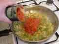 Adding chopped peeled tomatoes