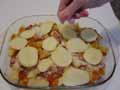 Adding more salt to second potato layer
