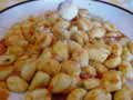 Add grated Parmesan cheese to the gnocchi