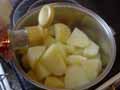 Adding pepper to potatoes Adding pepper to potatoes