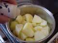 Adding salt to potatoes Adding salt to potatoes