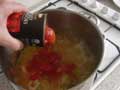 Adding tinned plum tomoatoes