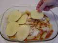 Adding a layer of potatoes