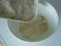 Adding breadcrumbs to Parmesan cheese. Adding breadcrumbs to Parmesan cheese.
