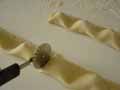 Cutting the tortelli mounds using a pastry wheel cutter