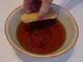 Dip one side of the savoiardi biscuits