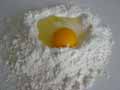Add eggs to flour Add eggs to flour