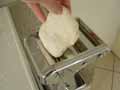 Putting dough through pasta machine