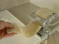 Dough going through pasta machine