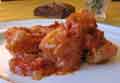 Baccala alla romana or salt cod with tomato sauce