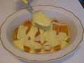 Spoon custard over biscuits