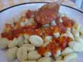 Spoon tomato sauce over the gnocchi