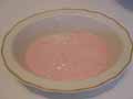Spread the strawberry blancmange over the entire base
