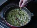 Crumble vegetable stock cube onto fried onion and garlic Crumble vegetable stock cube onto fried onion and garlic