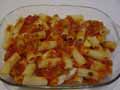 Tomato sauce layer on top of rigatoni pasta tubes